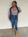 Pink, blue, and purple floral fit with a beautiful blouse-like top, 3/4th sleeves, and a bow to tie it in the bottom.